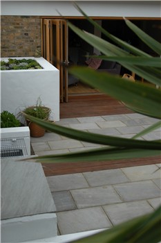 Looking back from the far corner of the garden over the built in BBQ